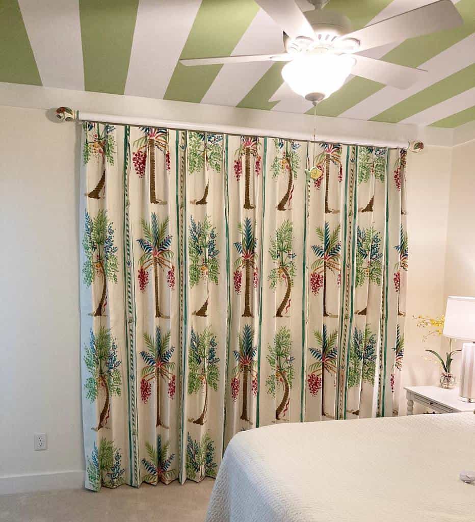green and white stripe ceiling with floral curtains 