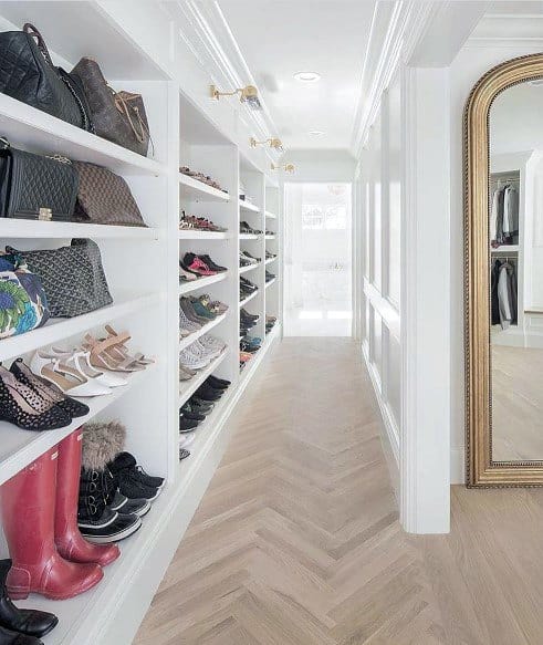 walk-in closet with crown molding 