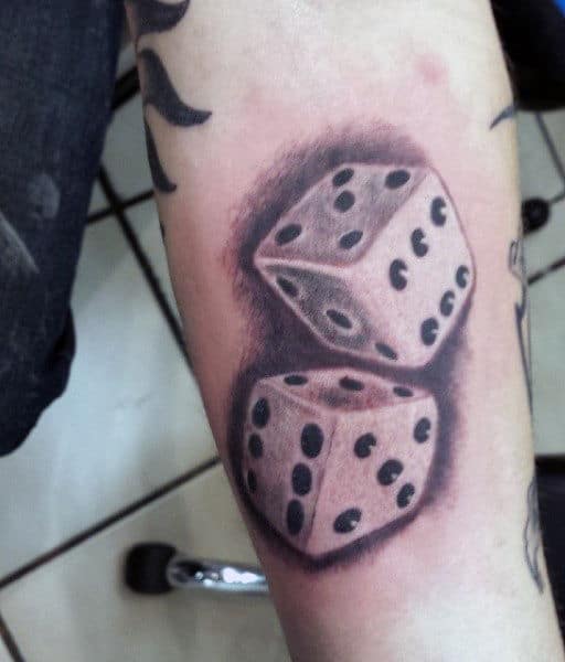 Microrealistic dice tattoo on the hand