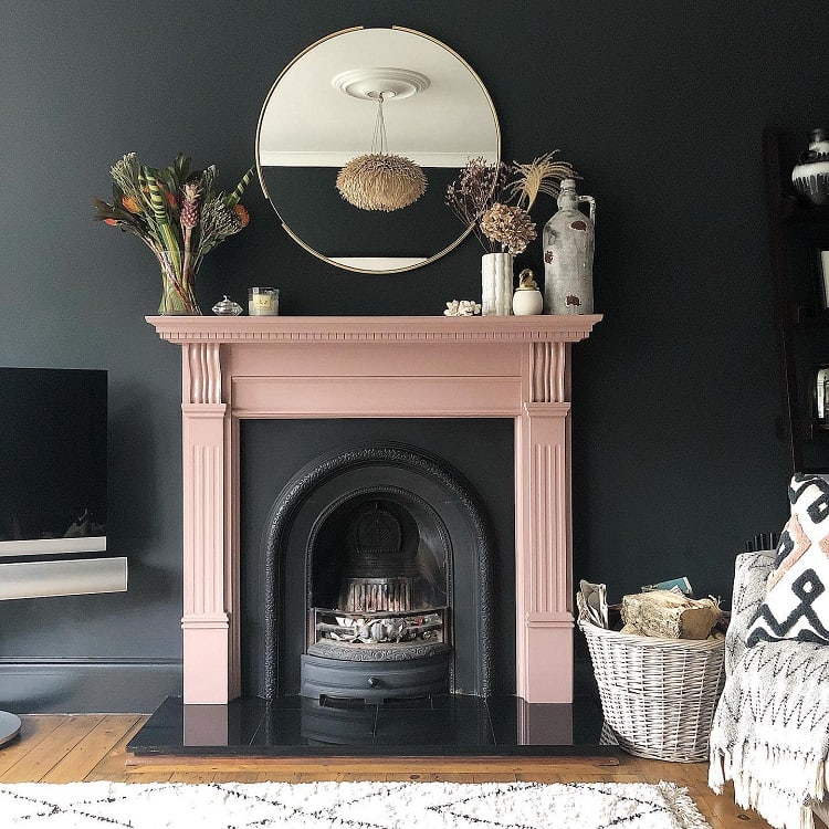 pink and black arch fireplace surround wall mirror