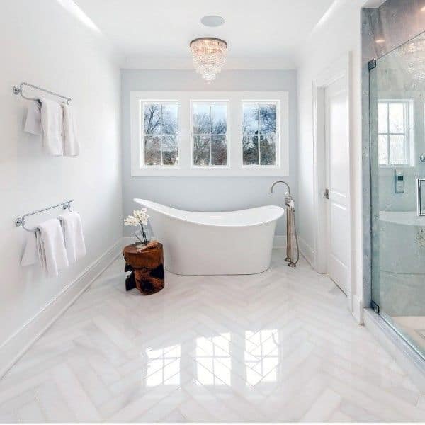 large white bathroom with freestanding tub