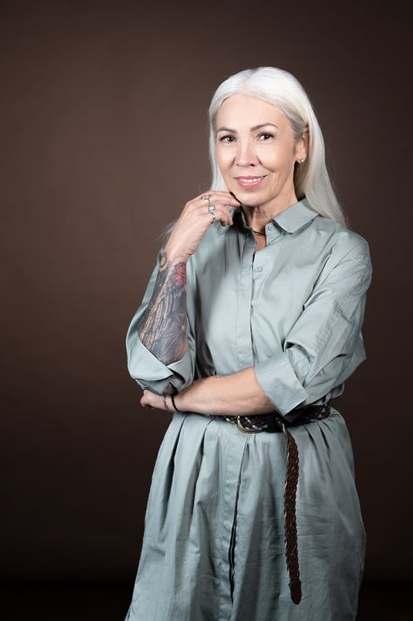 portrait of a woman with tattoo in her hand