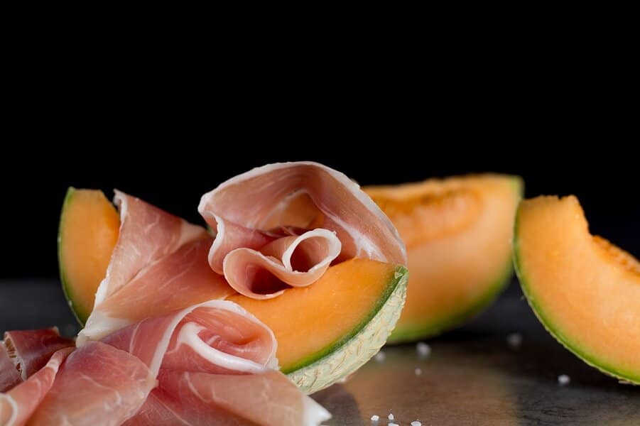 prosciutto sliced with melon