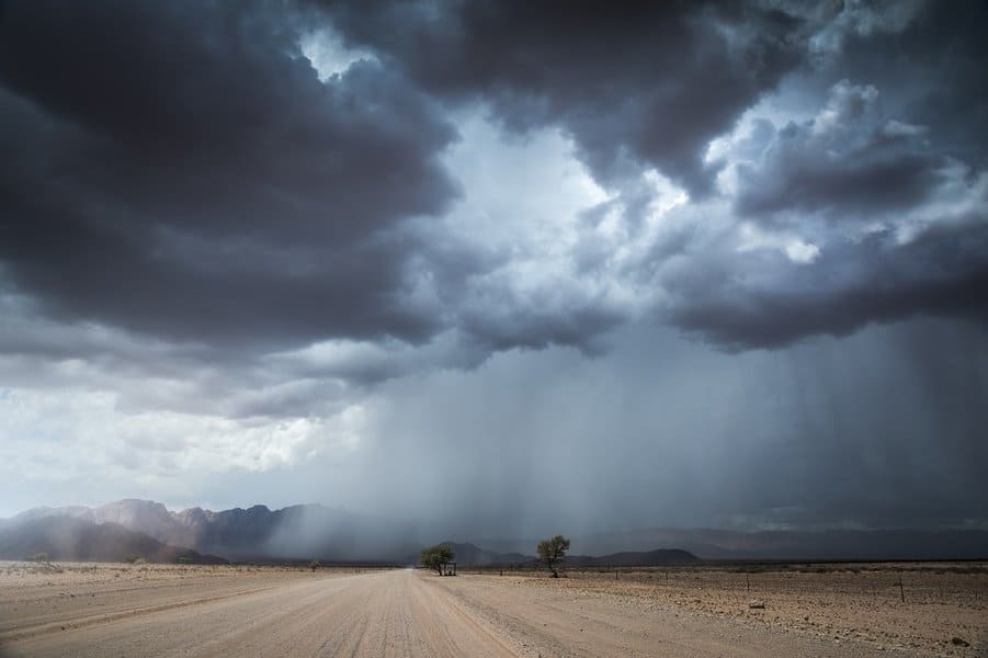 rain and thunder storm with mountains in the distance in the dry Namib Desert