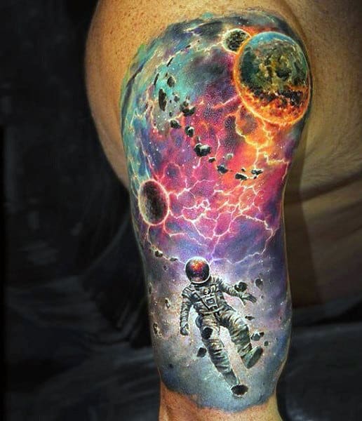 Astronaut tattoo on the back of the left arm