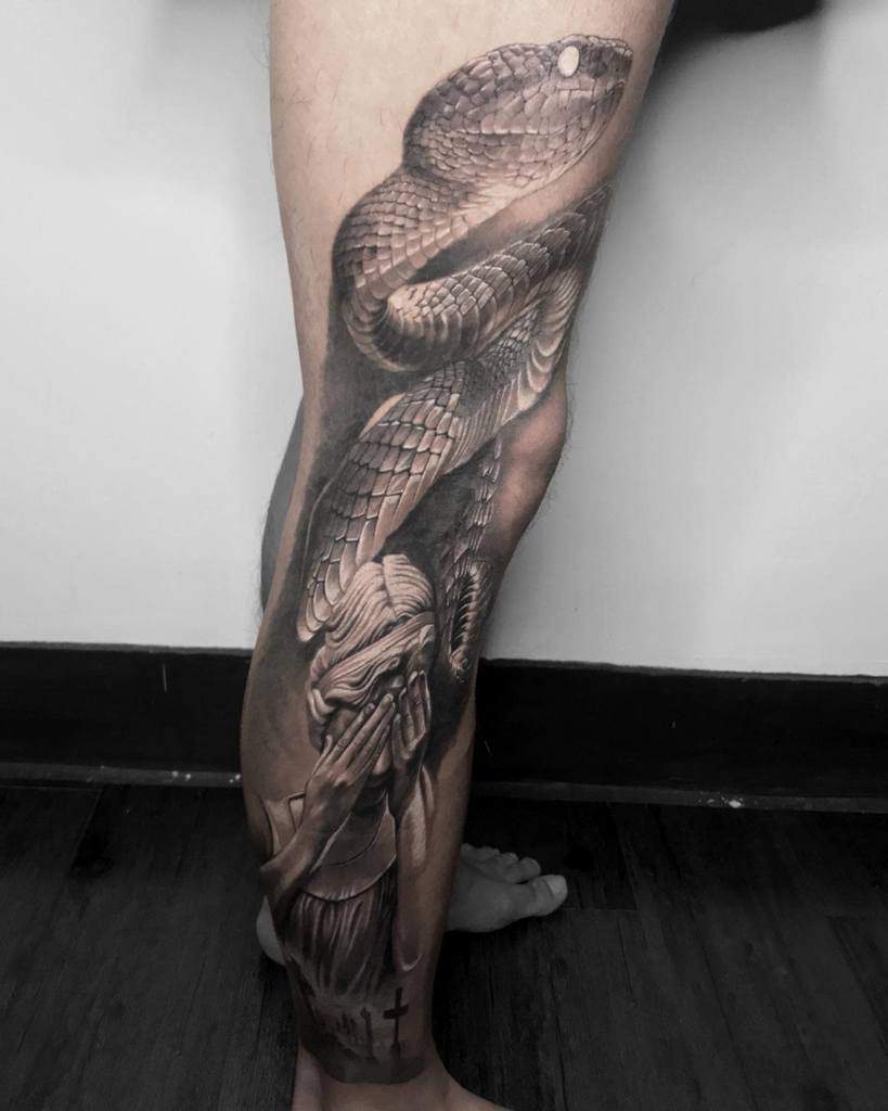 Realism black gray inked leg sleeve snake tattoo