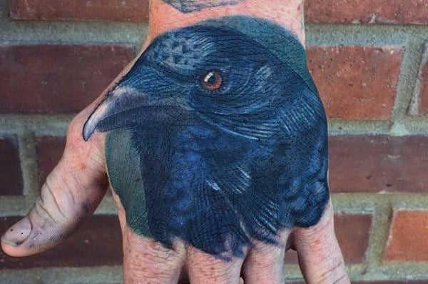 Realistic Blue Head Of Raven Tattoo Guys Hands
