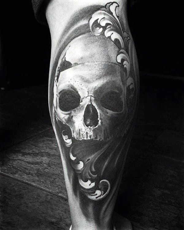 Realistic Detailed Skull Filigree Back Of Leg Tattoo On Male