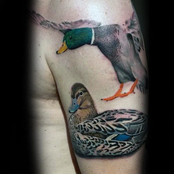 Realistic Ducks Tattoo Mallard Flying On Mans Bicep.