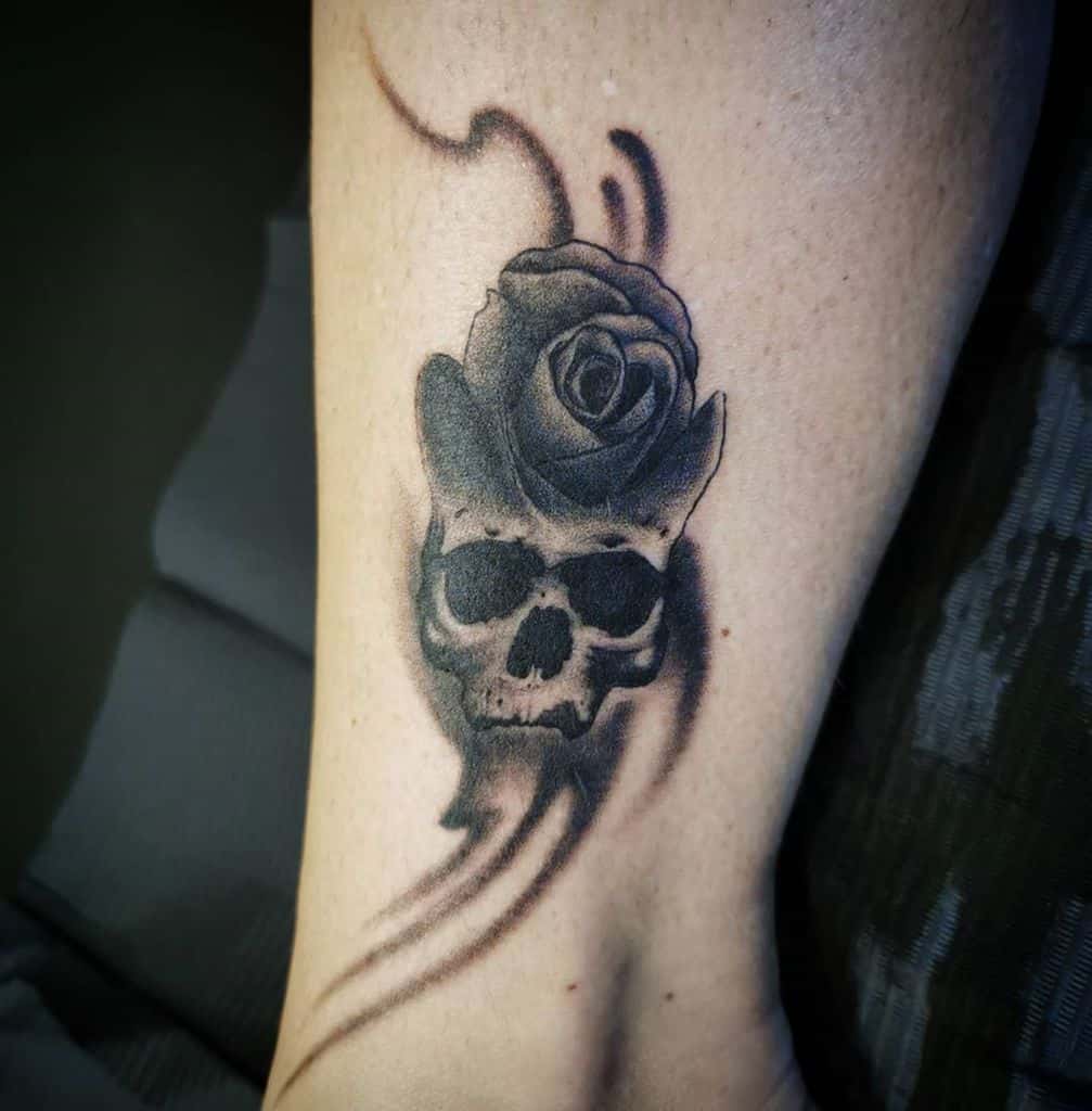 realistic-feminine-skull-and-rose-tattoo-nikosrustyneedle