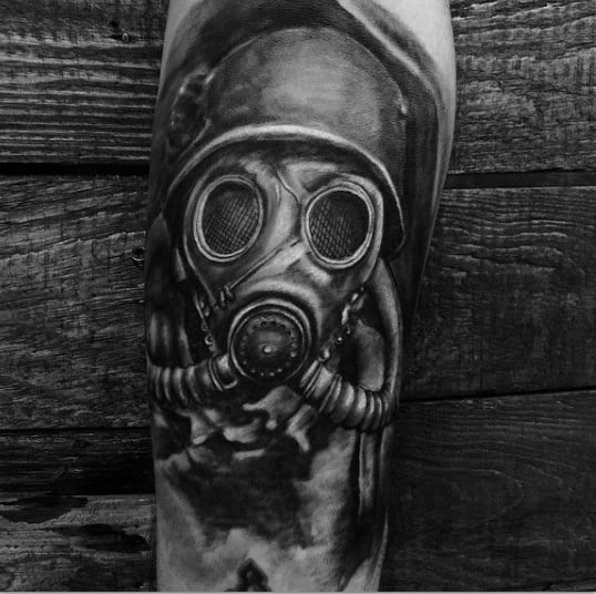 Realistic Gas Mask Tattoo In Black Ink On Mens Forearm