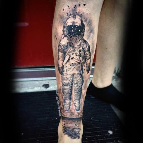 Realistic Mens Shin Tattoo Of Astronaut