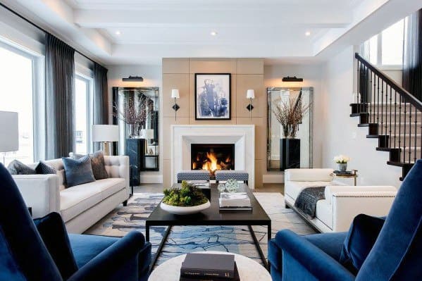contemporary living room fireplace white sofa blue chairs 