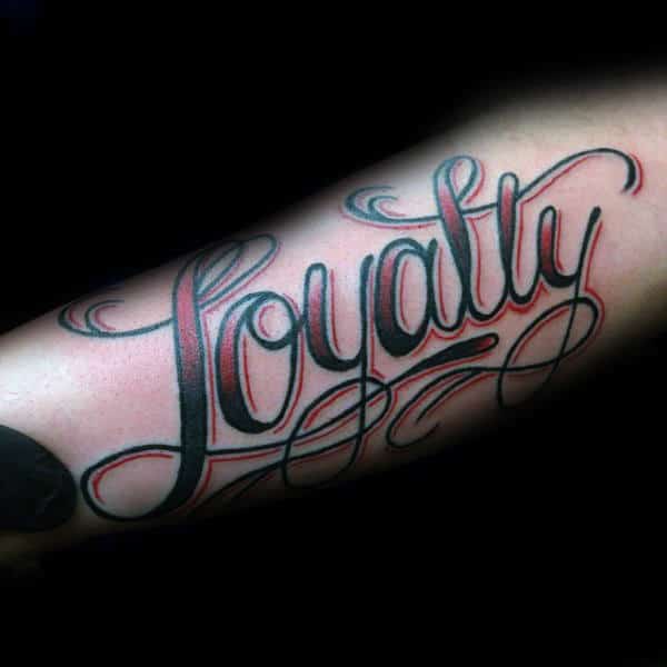 Black Loyalty Tattoo On Left Forearm
