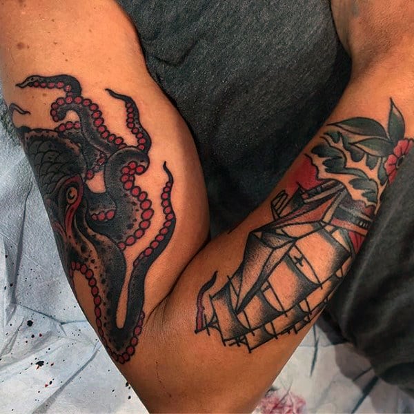 Red And Black Ink Traditional Octopus Mens Arm Tattoos