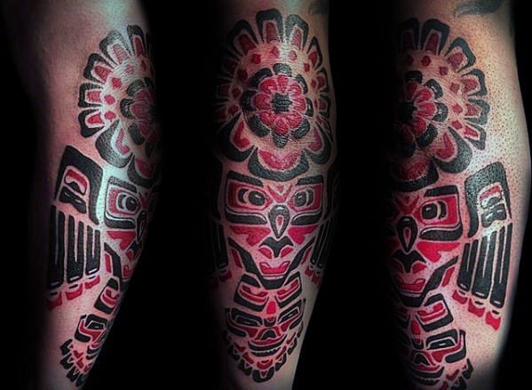 Red And Black Ink Tribal Owl Mens Forearm Tattoo