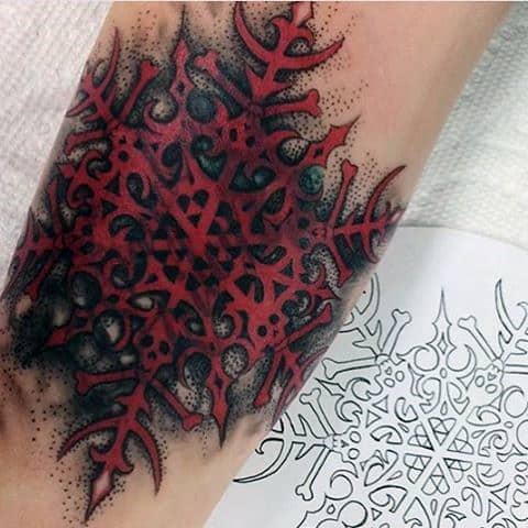 Red Ink Snowflake Mens Forearm Tattoo With Skeleton Design