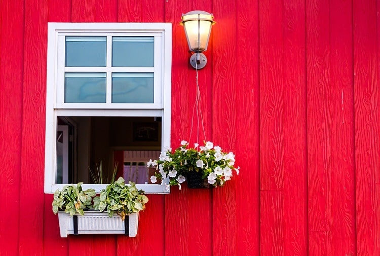 red wall exterior white window trim