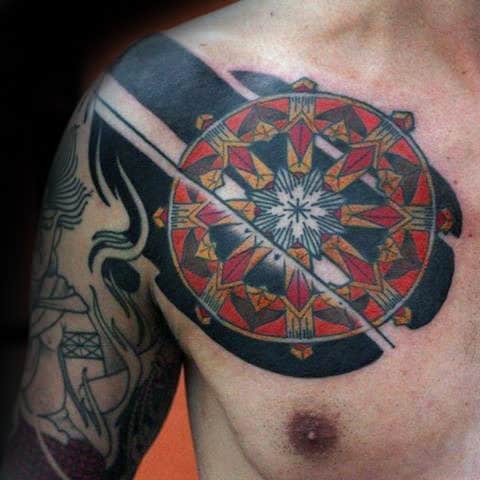 Red Yellow And Black Ink Male Dharma Wheel Chest Tattoos