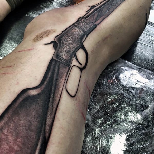 Rifle Smoking Gun Tattoo On Man