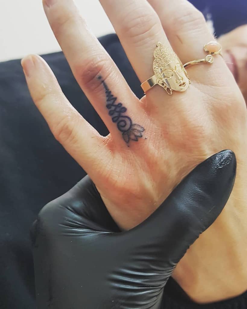 Ring Finger Unalome Tattoo