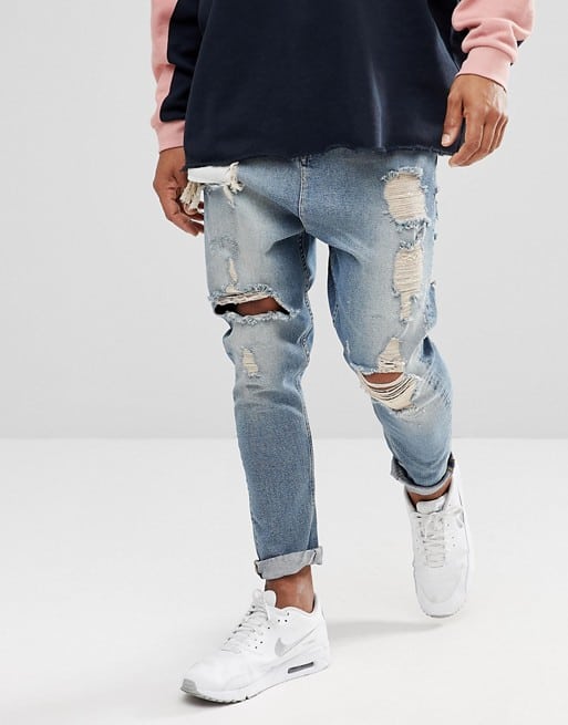 drop crotch jeans in vintage light wash blue with heavy rips