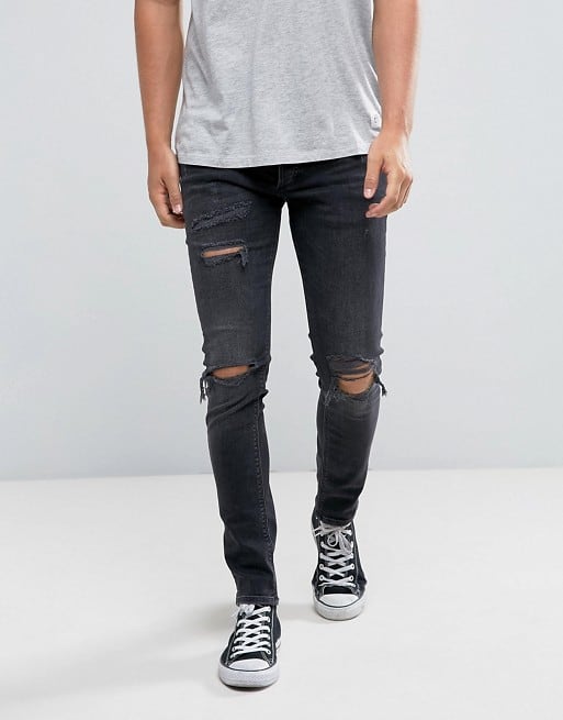 skinny jeans with rips in black wash