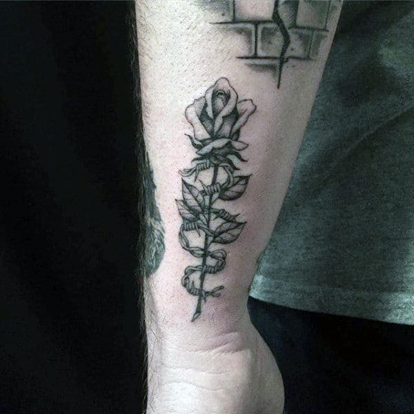 Rose With Barbed Wire Thorns Mens Lower Forearm Tattoo