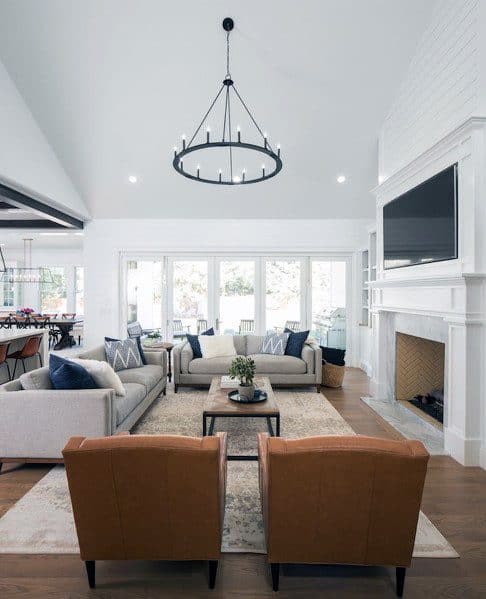 modern living room gray sofa and tan recliners 
