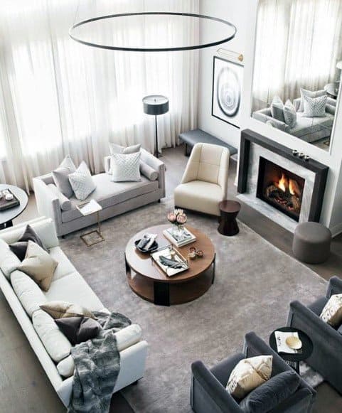 contemporary grey living room fireplace sofas and lounge chairs wood coffee table 