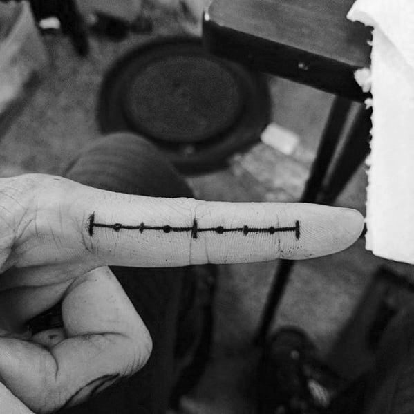 Ruler Finger Tattoo Designs For Guys