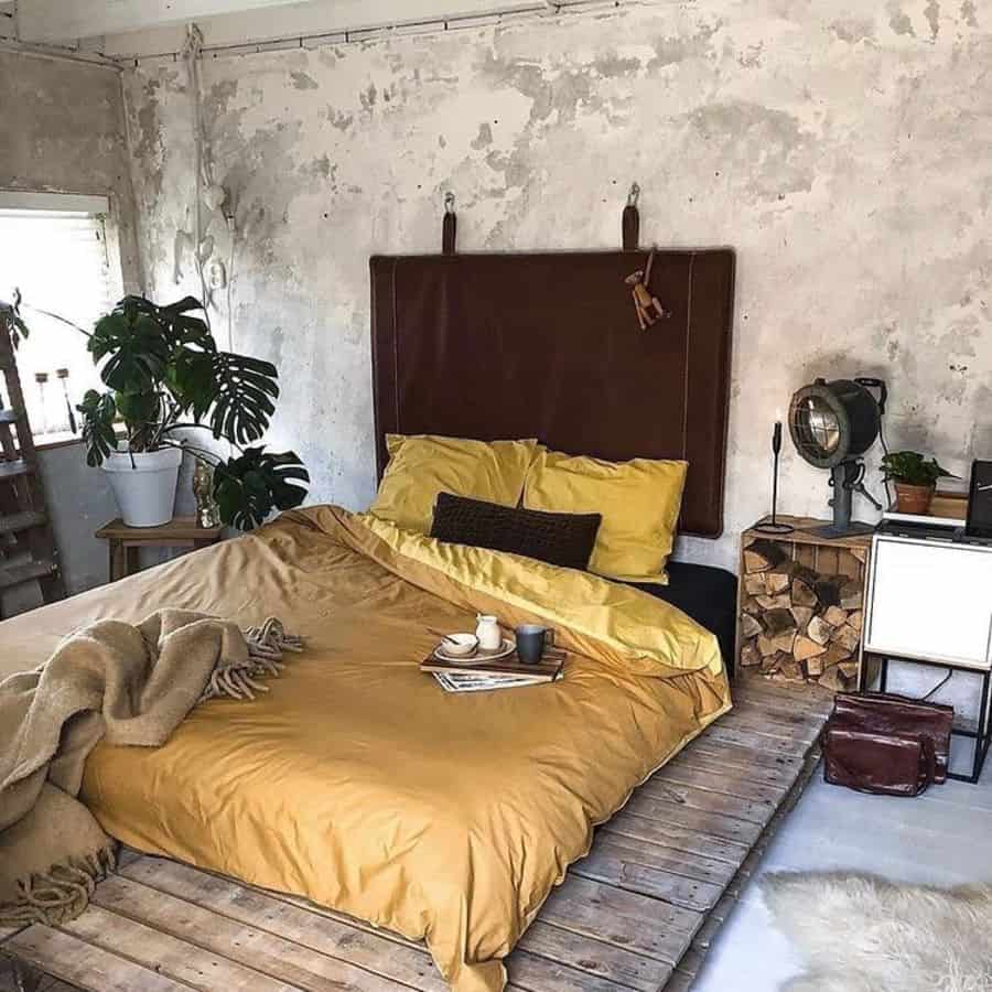 exposed concrete wall yellow platform bed