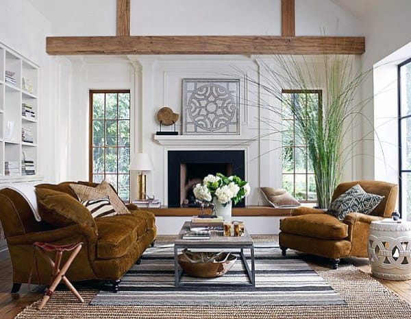 small formal living room sofas fireplace exposed wood beam 