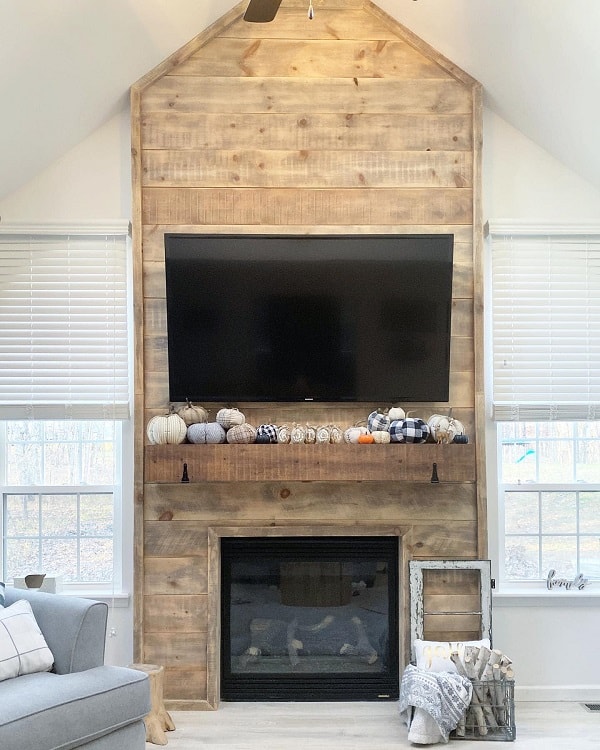 rustic decor wood panels fireplace surround wall mounted tv