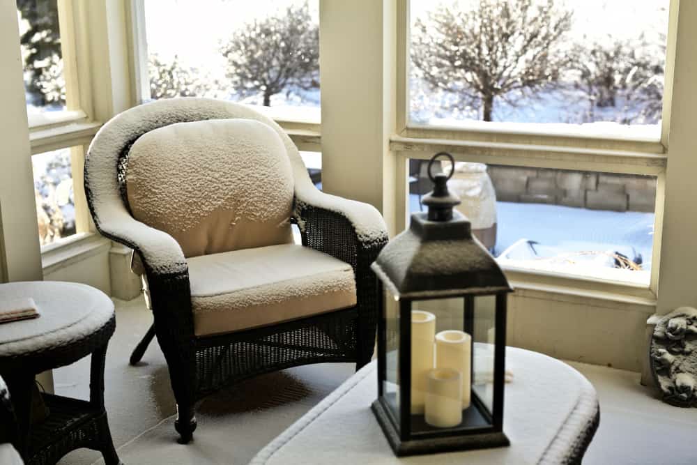 rustic enclosed patio chair and table candles 