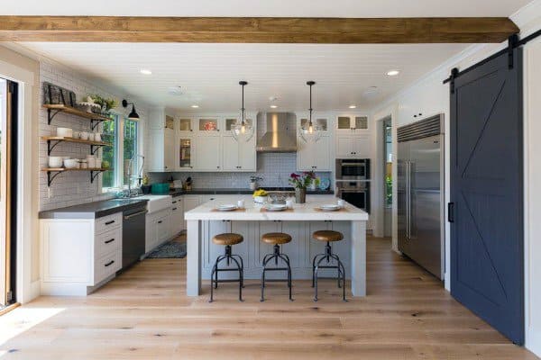 large rustic kitchens with island and painted sliding barn door