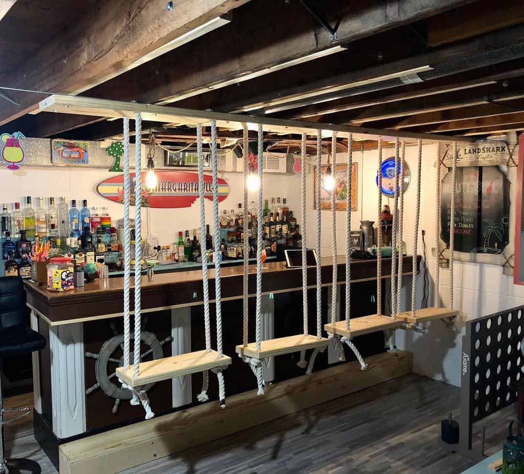 basement bar with swings as seats 