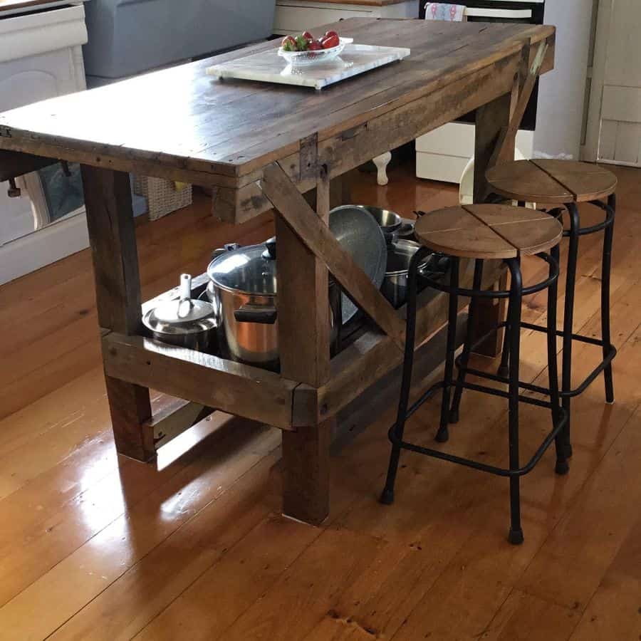 rustic wood table island in farmhouse kitchen 