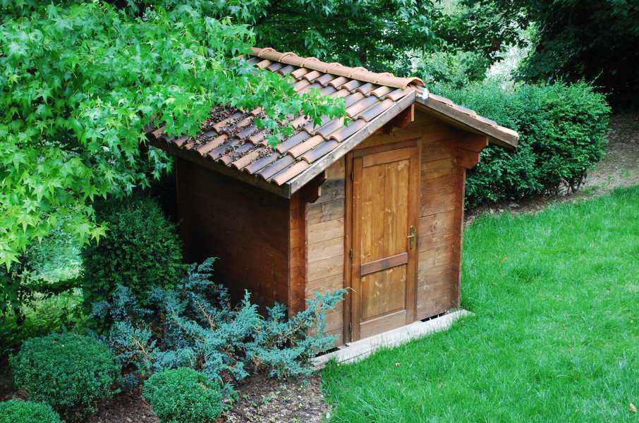 rustic wood shed with tiled roof