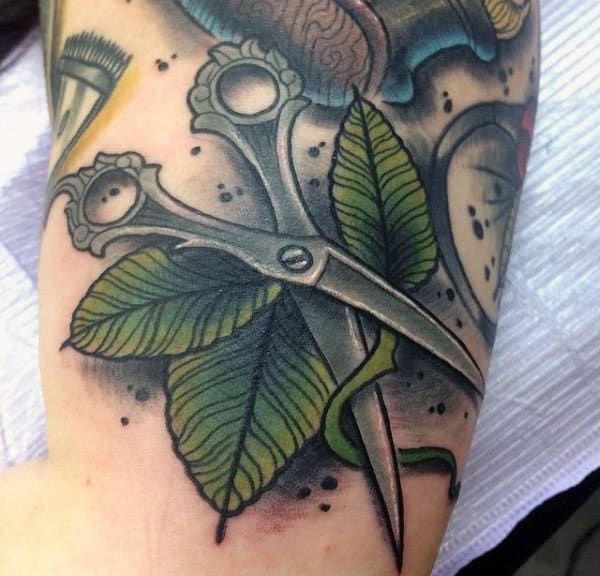 Scissors Cutting Stem Of Green Leaves Mens Arm Tattoos