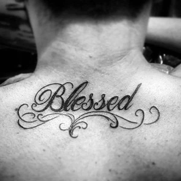 Black and grey shaded angel wings blessed texted tattoo on chest for men