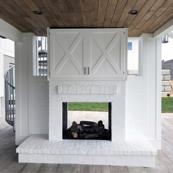 See Through White Painted Brick Patio Fireplace Design Ideas