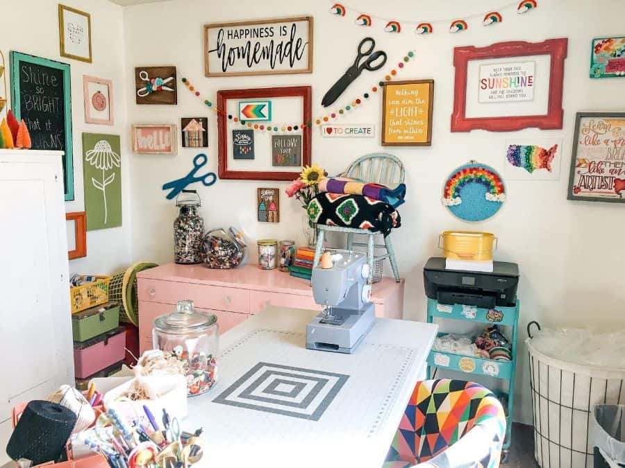 diy sewing room with lots of wall art and decor 