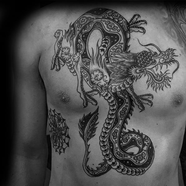 Shaded Black And Grey Chest Traditional Dragon Tattoos For Men