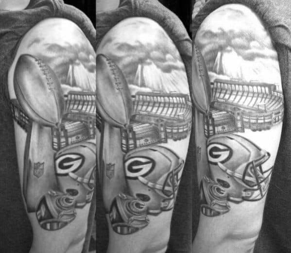 Shaded Black And Grey Green Bay Packers Stadium Tattoo On Arm.