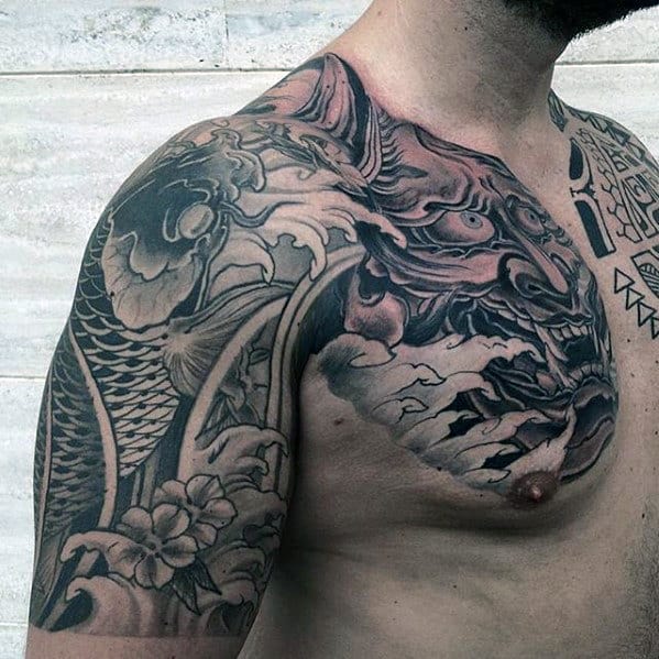 Shaded Black And Grey Guys Japanese Upper Chest And Arm Tattoos