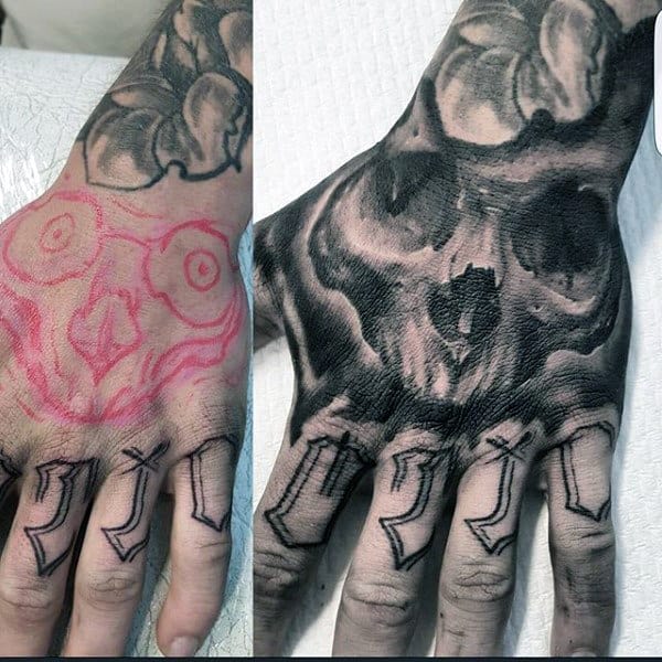 Shaded Black And Grey Guys Skull Tattoo On Hands