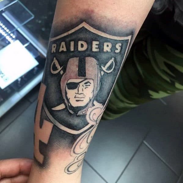 Shaded Black And Grey Ink Oakland Raiders Male Negative Space Forearm Tattoo
