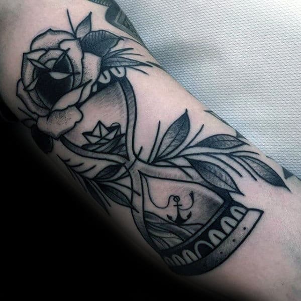 Shaded Black And Grey Traditional Hourglass Mens Arm Tattoo