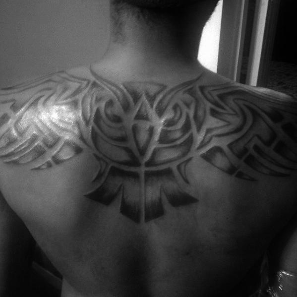 Shaded Black And Grey Upper Back Tribal Owl Tattoos For Males